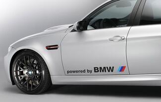 Paar Aufkleber „BMW powered by BMW“.
